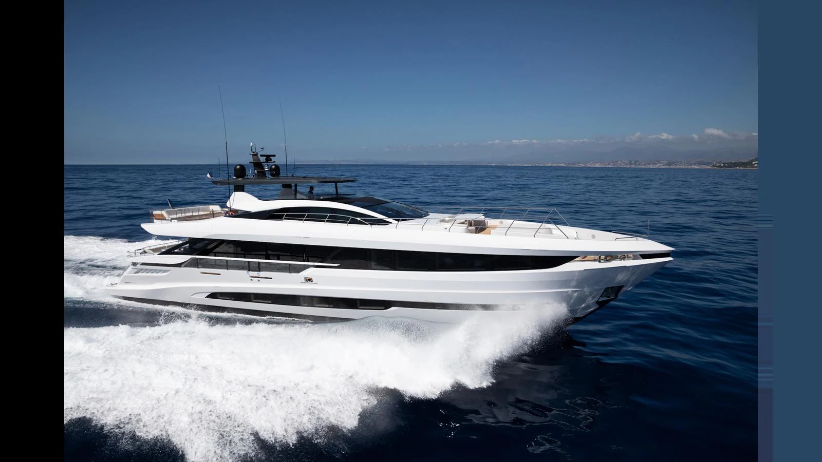 A sleek and modern yacht cruising on the open sea under a clear sky. aboard ARTEMIS Yacht for Sale