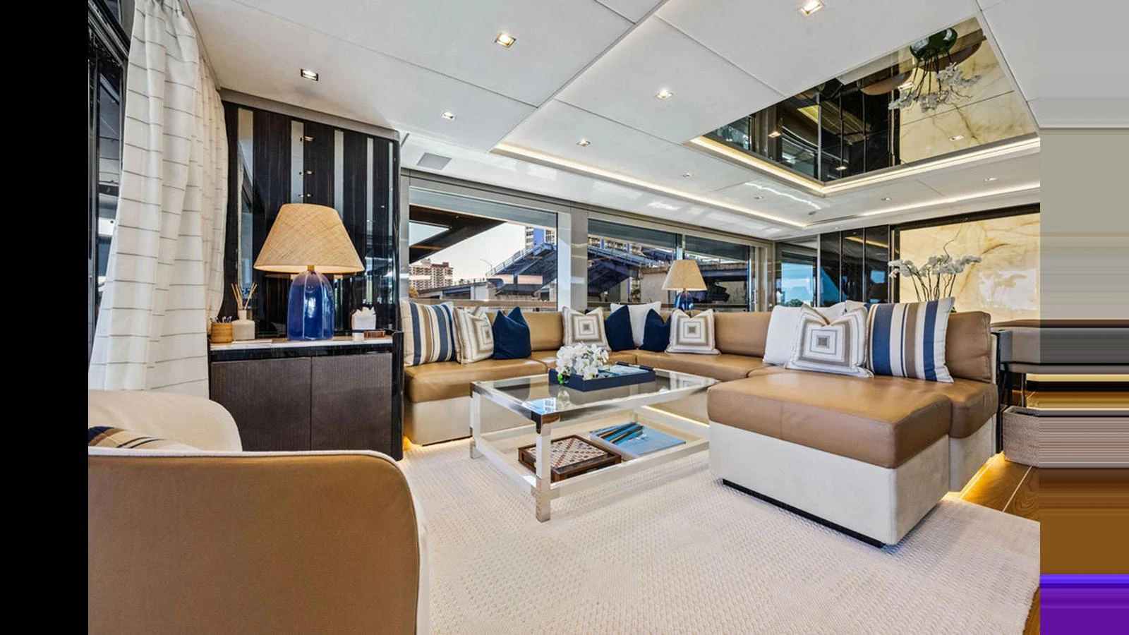 The salon features luxurious seating, elegant decor, and ample natural light. aboard ARTEMIS Yacht for Sale