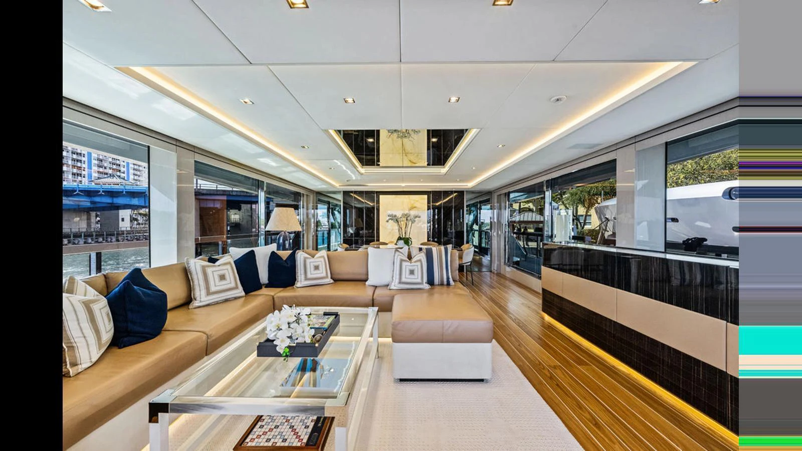 The yacht's salon features a spacious and elegantly designed seating area with modern decor and large windows offering panoramic views. aboard ARTEMIS Yacht for Sale
