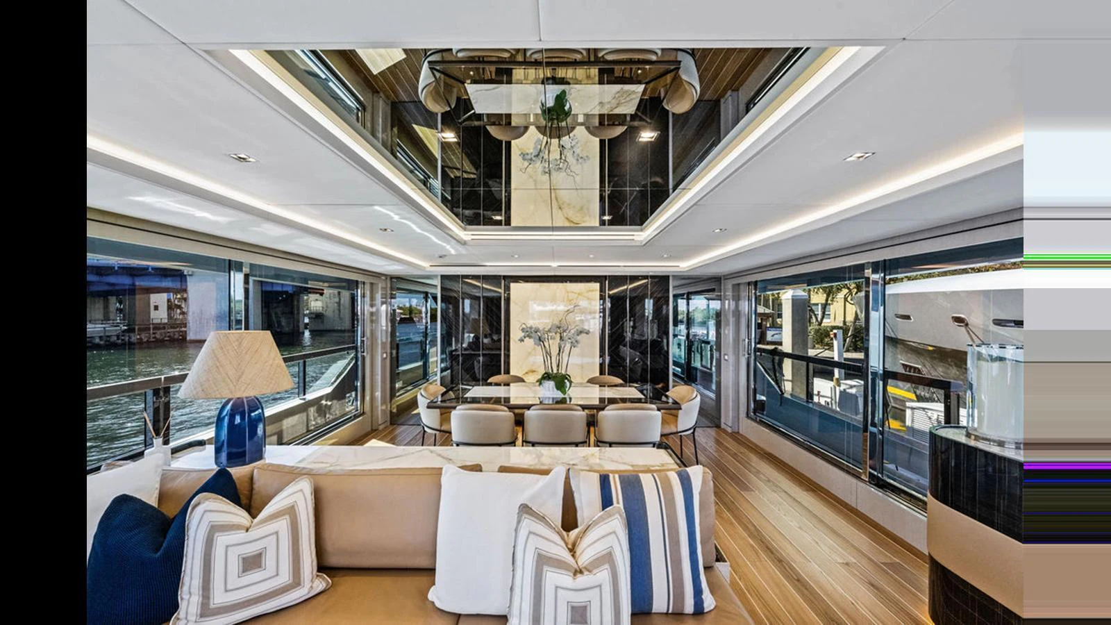 The yacht's salon features luxurious seating, elegant decor, and expansive windows for a bright and inviting atmosphere. aboard ARTEMIS Yacht for Sale
