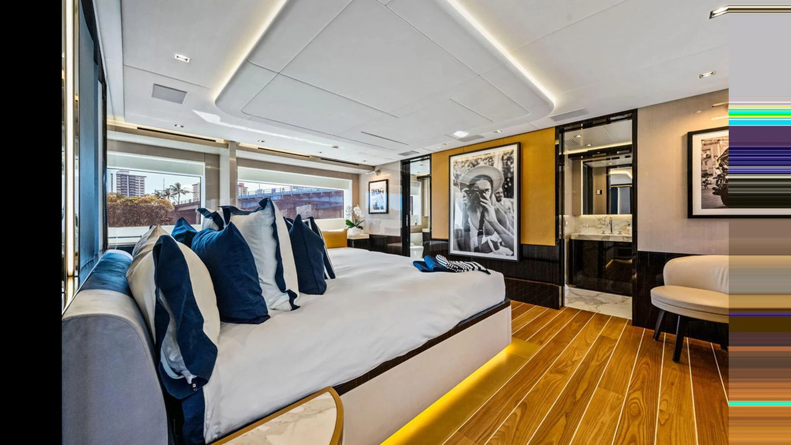 The master stateroom features a luxurious bed with plush pillows and elegant decor, offering a serene retreat. aboard ARTEMIS Yacht for Sale