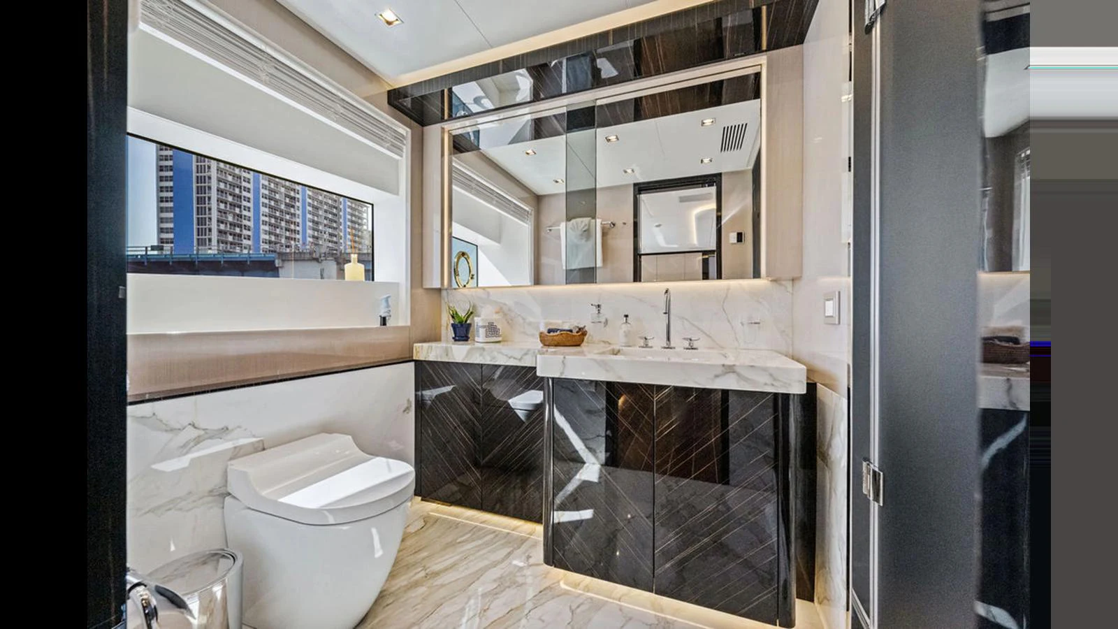 The yacht's bathroom features modern fixtures and a luxurious design with marble accents. aboard ARTEMIS Yacht for Sale