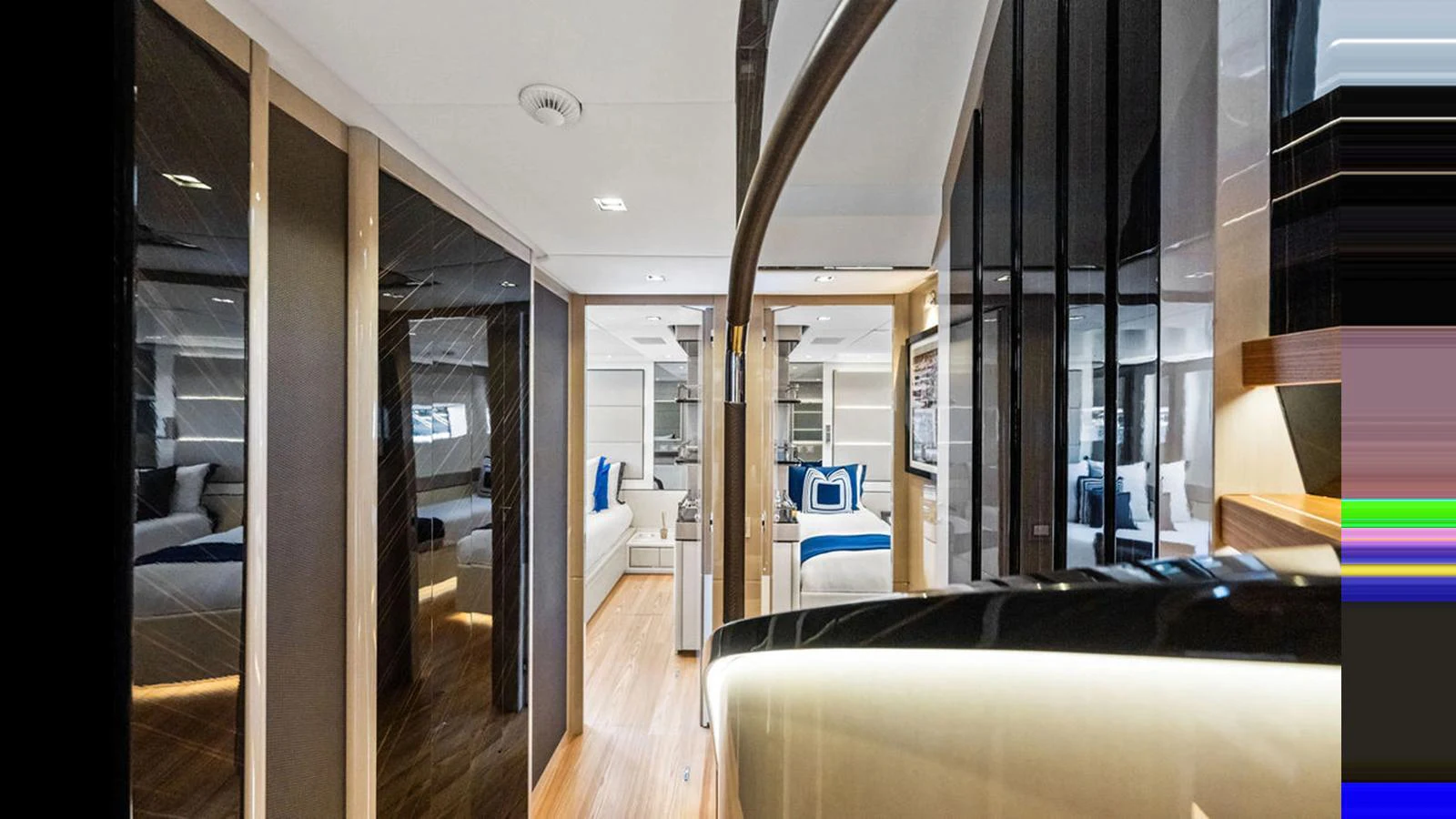 The yacht's interior features a modern and luxurious hallway with sleek finishes and elegant decor. aboard ARTEMIS Yacht for Sale