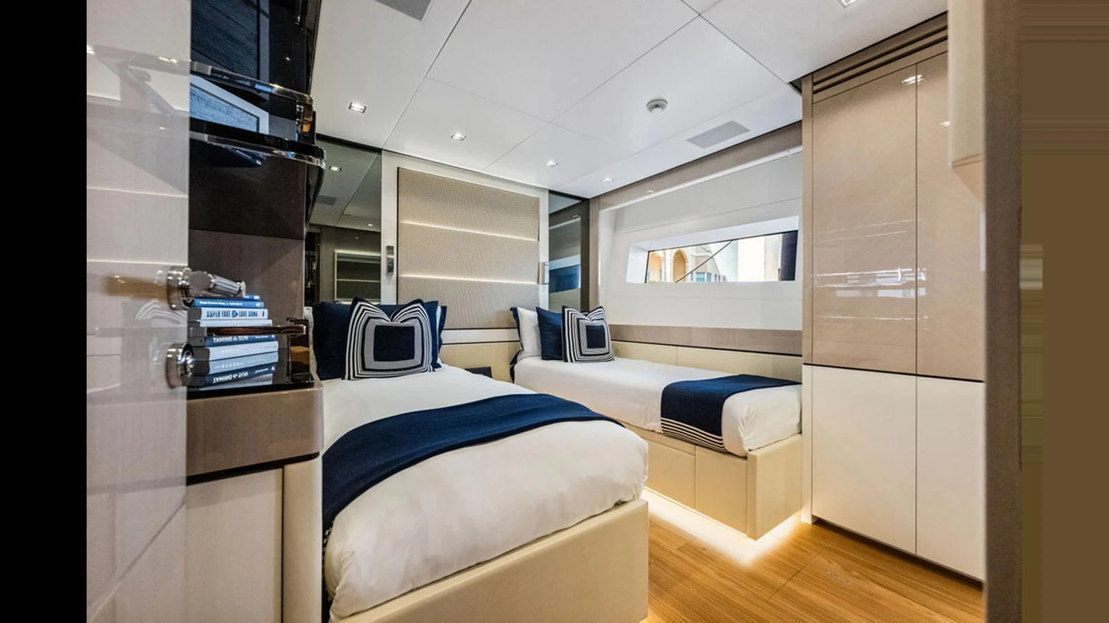 The guest stateroom features two twin beds with elegant bedding and modern decor. aboard ARTEMIS Yacht for Sale