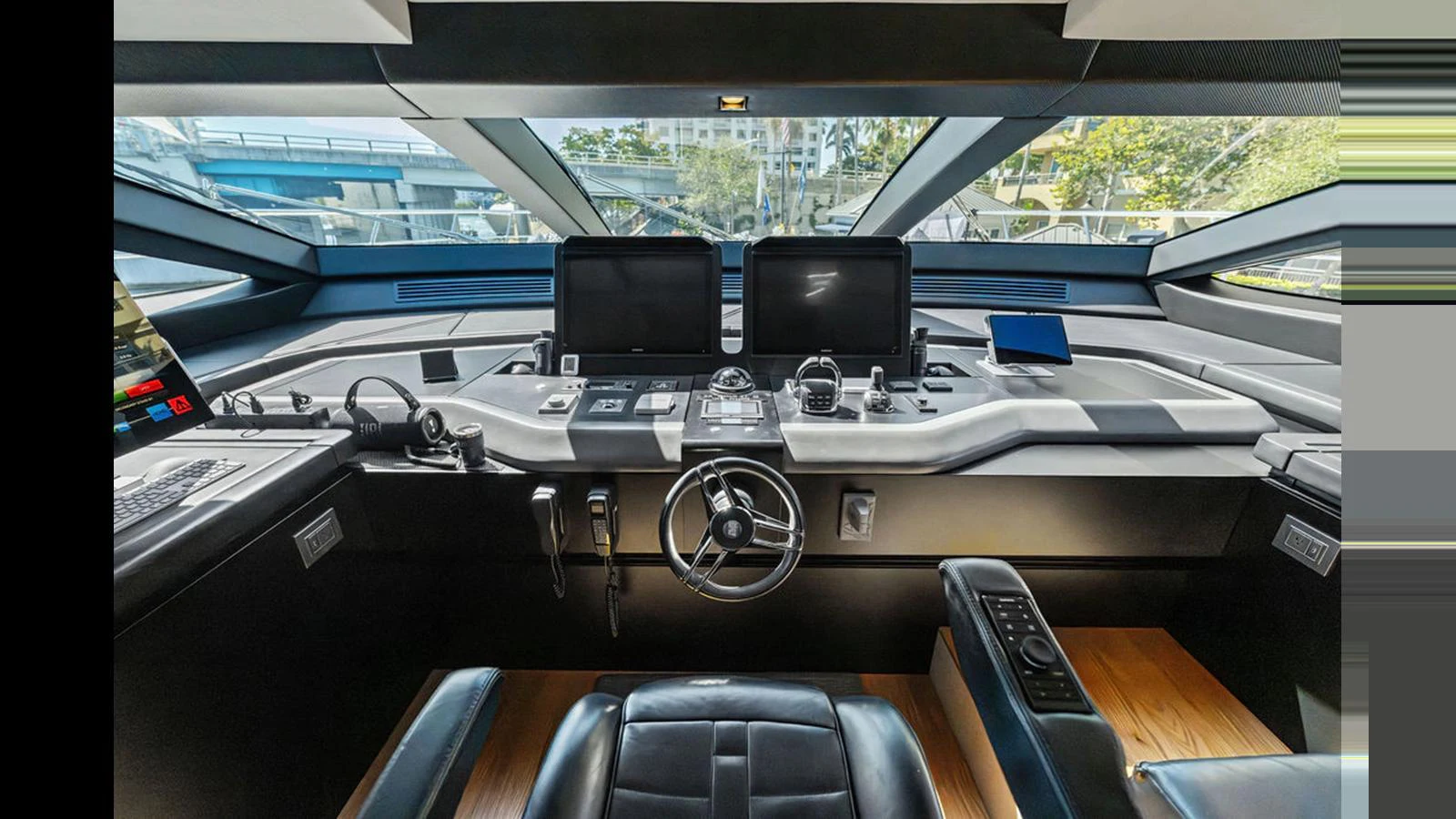 The helm station features advanced navigation equipment and a sleek, modern design. aboard ARTEMIS Yacht for Sale