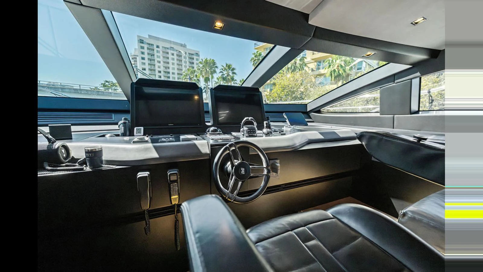 The helm station features sleek, modern controls and panoramic windows for optimal visibility. aboard ARTEMIS Yacht for Sale