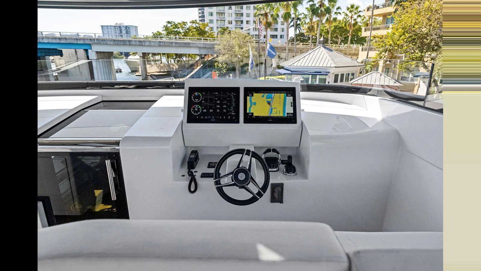 The helm station features modern navigation equipment and a sleek steering wheel, offering a commanding view for the captain. aboard ARTEMIS Yacht for Sale