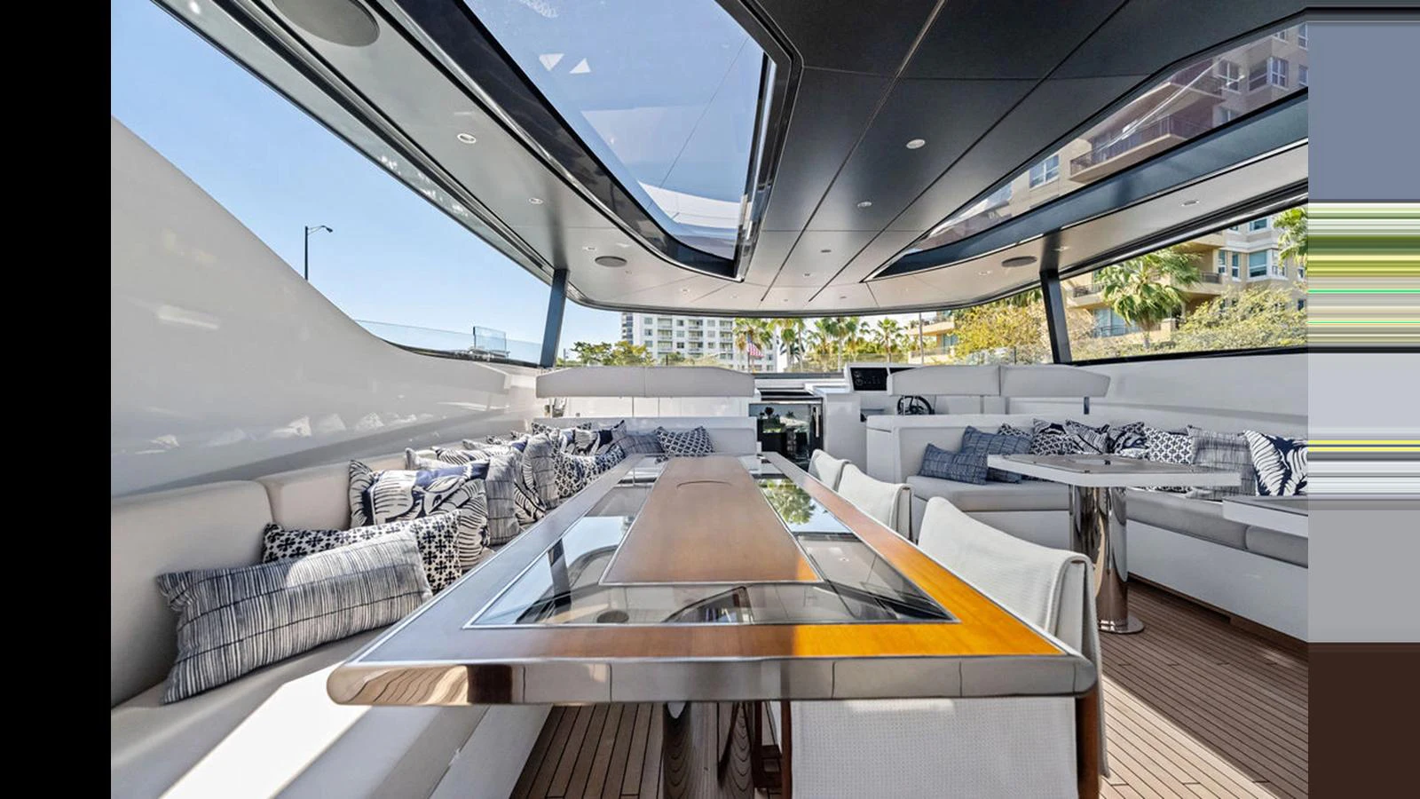 The yacht's salon features a spacious and luxurious seating area with ample natural light. aboard ARTEMIS Yacht for Sale