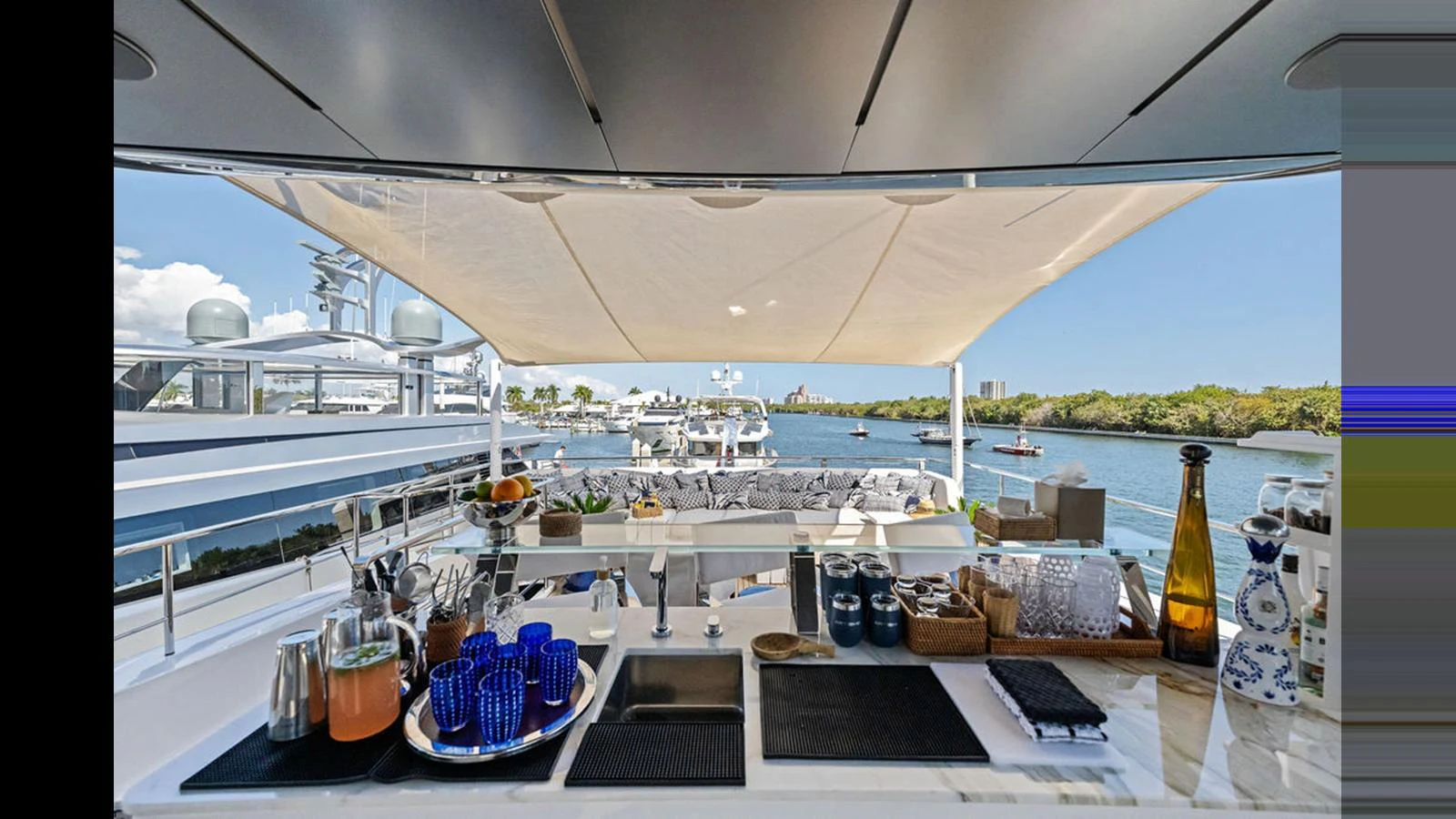 An elegant outdoor bar area on the yacht offers a perfect spot for refreshments with a scenic view. aboard ARTEMIS Yacht for Sale