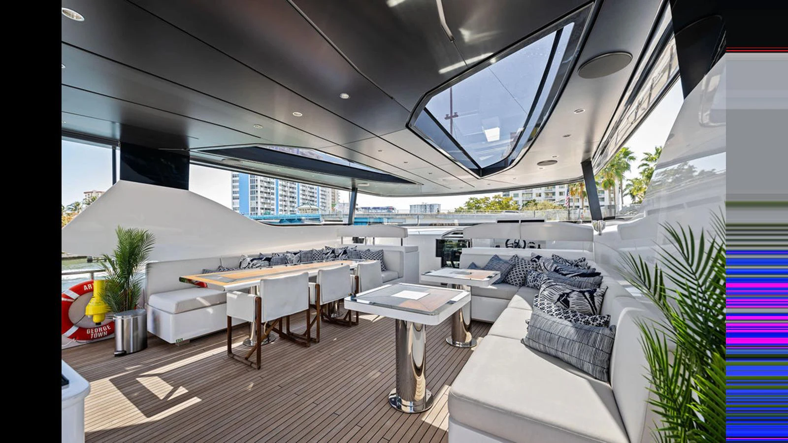 The aft deck features a spacious and stylish seating area with modern furnishings and ample natural light. aboard ARTEMIS Yacht for Sale