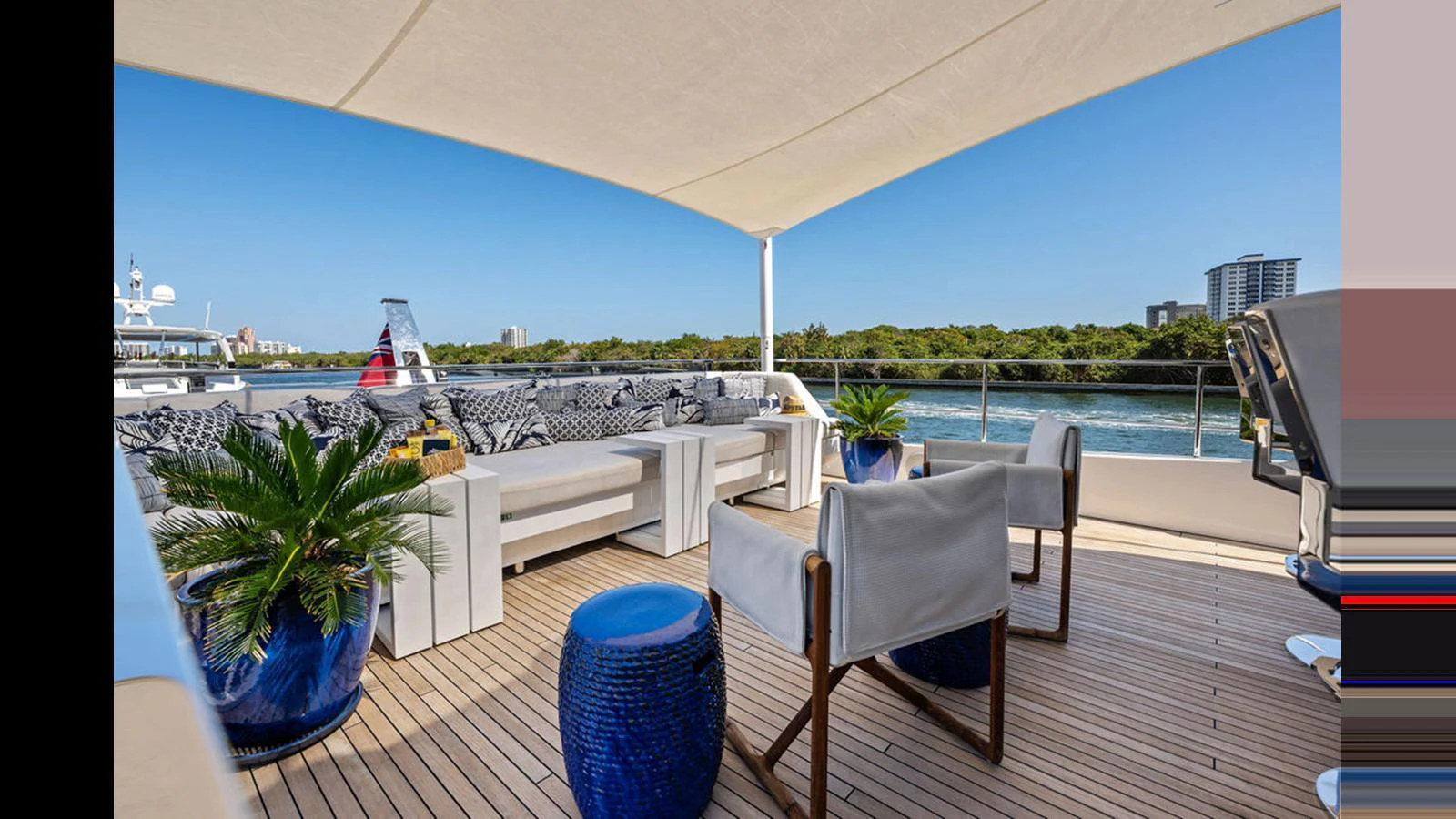 The sundeck offers a spacious and stylish outdoor seating area with comfortable furniture and scenic views. aboard ARTEMIS Yacht for Sale