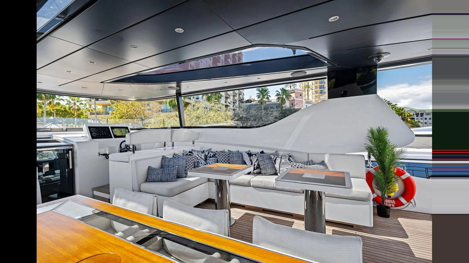 The salon features a spacious seating area with modern decor and ample natural light. aboard ARTEMIS Yacht for Sale
