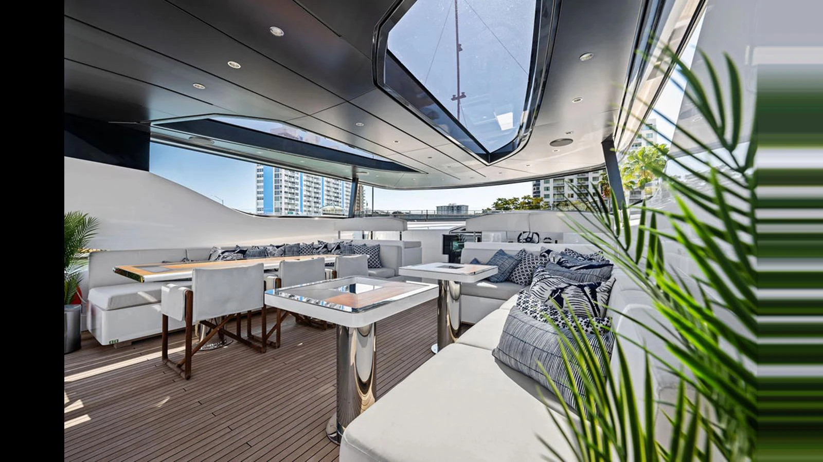 The aft deck features a spacious seating area with modern furnishings and ample natural light. aboard ARTEMIS Yacht for Sale