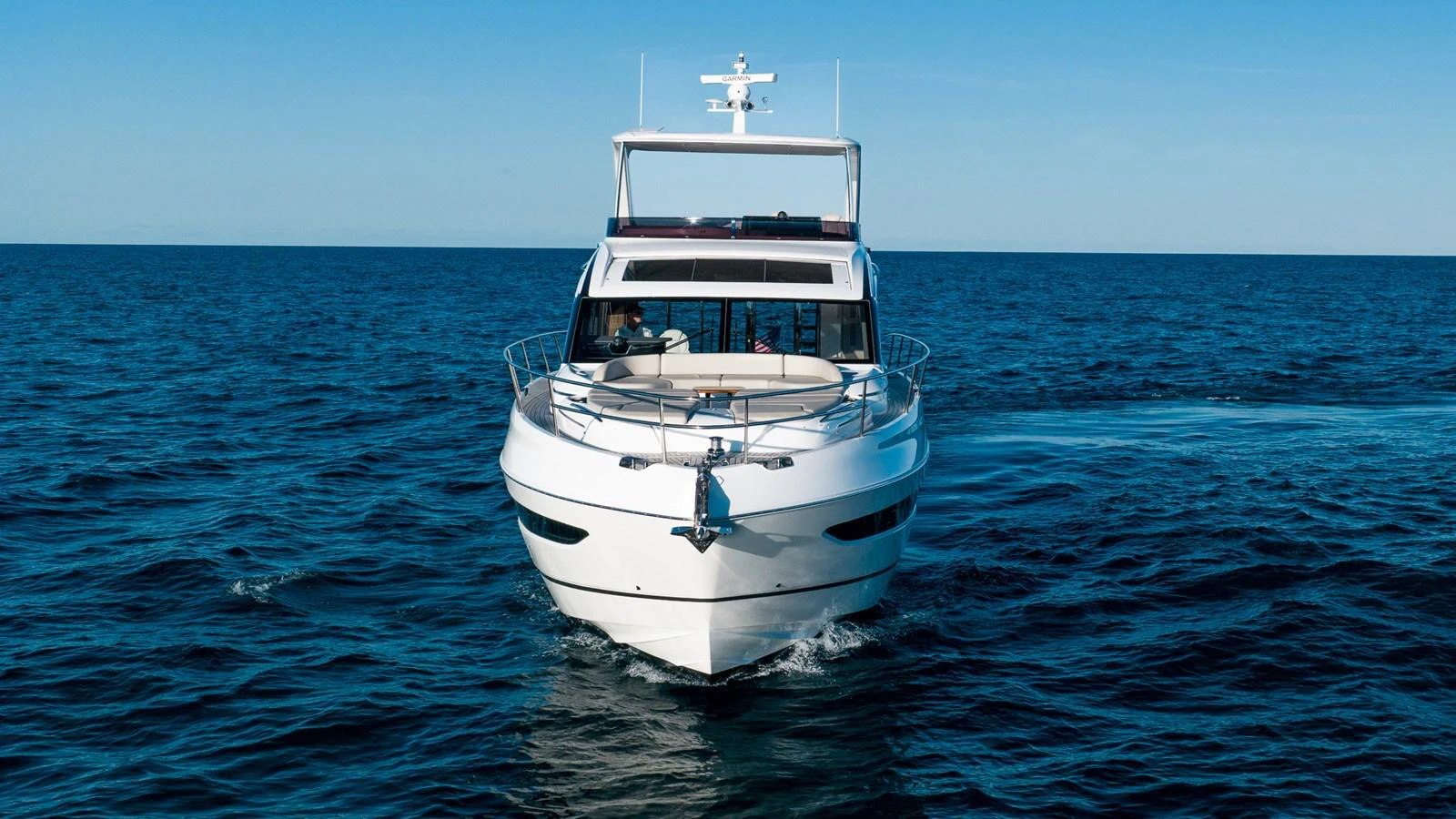 A sleek yacht glides gracefully on the open sea, showcasing its modern design and luxurious features. aboard NAUTILUS Yacht for Sale