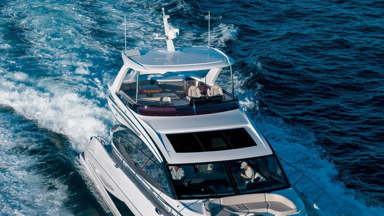 A sleek yacht cruises through the open water, showcasing its modern design and luxurious upper deck. aboard NAUTILUS Yacht for Sale