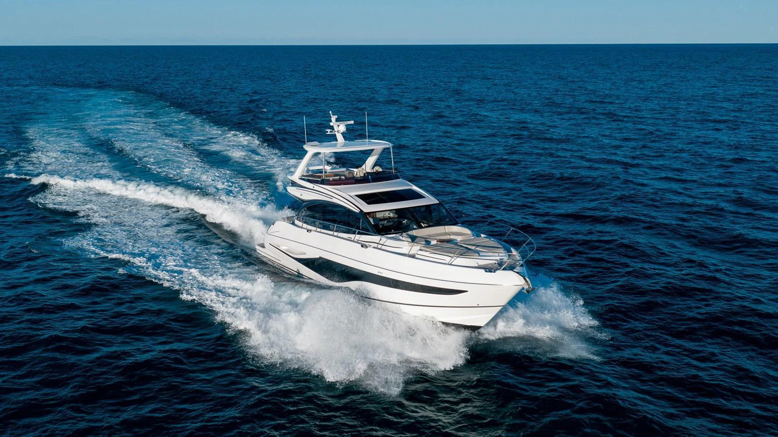 A sleek yacht cruises swiftly through the open sea, showcasing its modern design and powerful performance. aboard NAUTILUS Yacht for Sale
