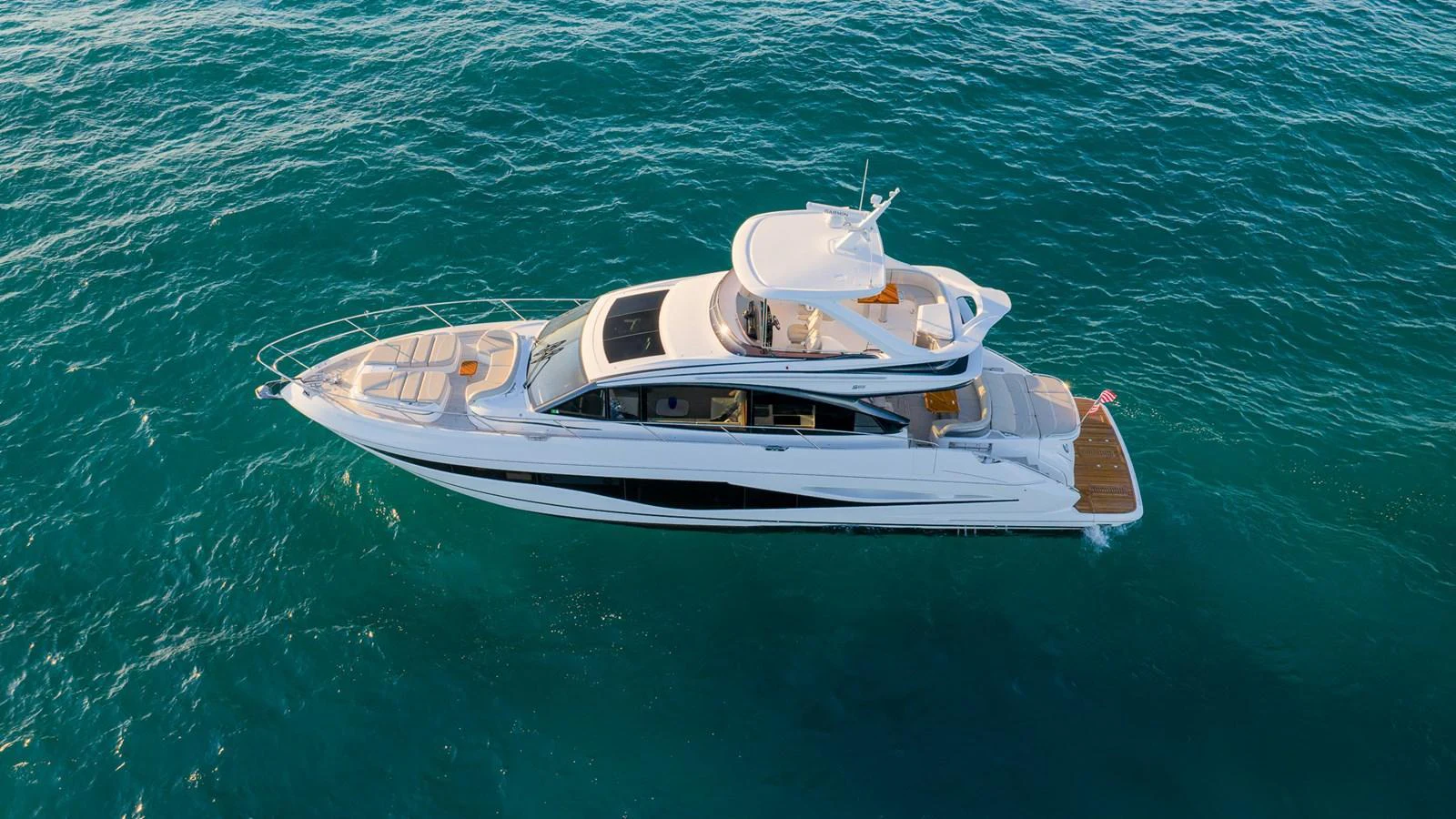 A sleek, modern yacht cruising on clear blue waters. aboard NAUTILUS Yacht for Sale