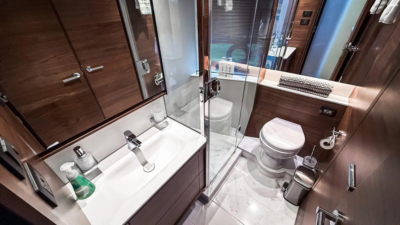 The yacht's bathroom features modern fixtures and a sleek design with ample storage space. aboard NAUTILUS Yacht for Sale