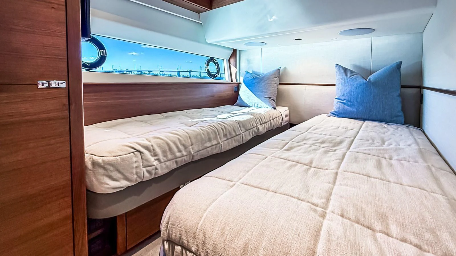 The twin stateroom offers a cozy and inviting space with two single beds and soft lighting. aboard NAUTILUS Yacht for Sale