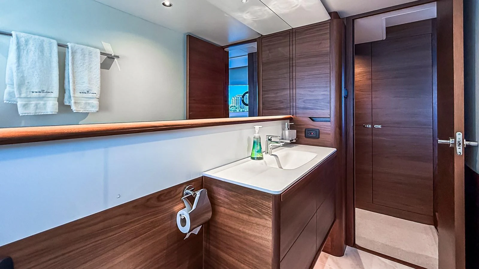 The yacht's bathroom features modern fixtures and elegant wood paneling. aboard NAUTILUS Yacht for Sale