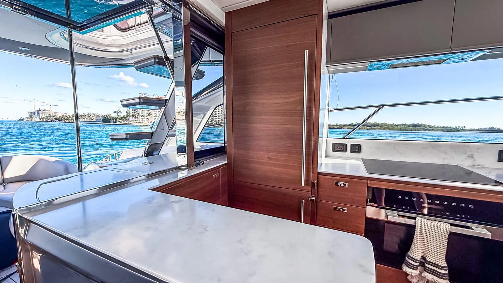 The yacht's galley features modern appliances and a sleek design with a view of the water. aboard NAUTILUS Yacht for Sale