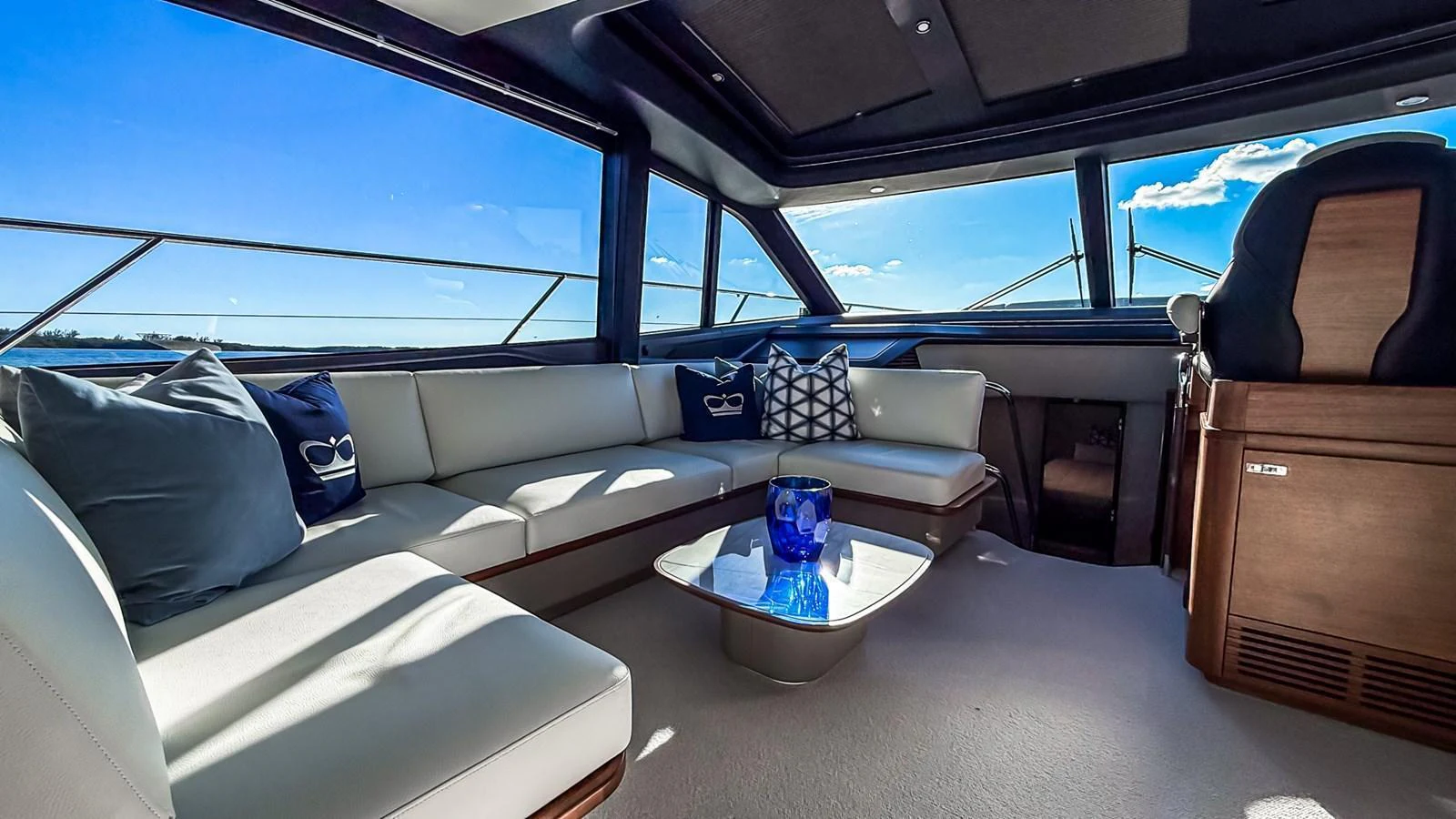 The salon features plush seating with panoramic windows offering stunning views. aboard NAUTILUS Yacht for Sale