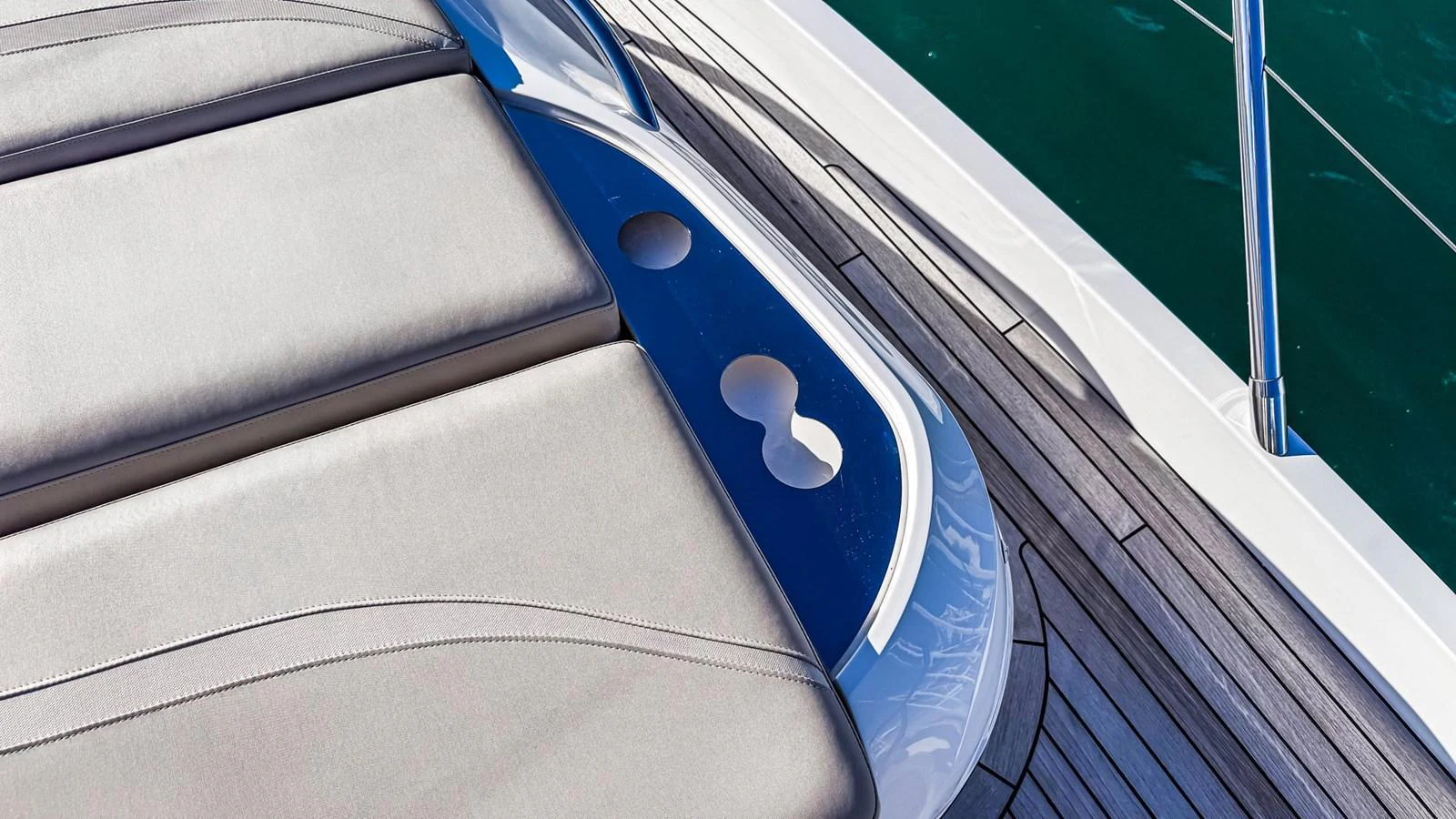 A close-up view of a sleek and modern yacht deck with cushioned seating and stylish design elements. aboard NAUTILUS Yacht for Sale