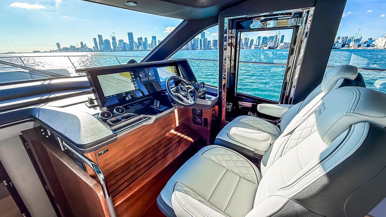 The helm of the yacht offers a sleek and modern control area with a stunning view of the city skyline. aboard NAUTILUS Yacht for Sale
