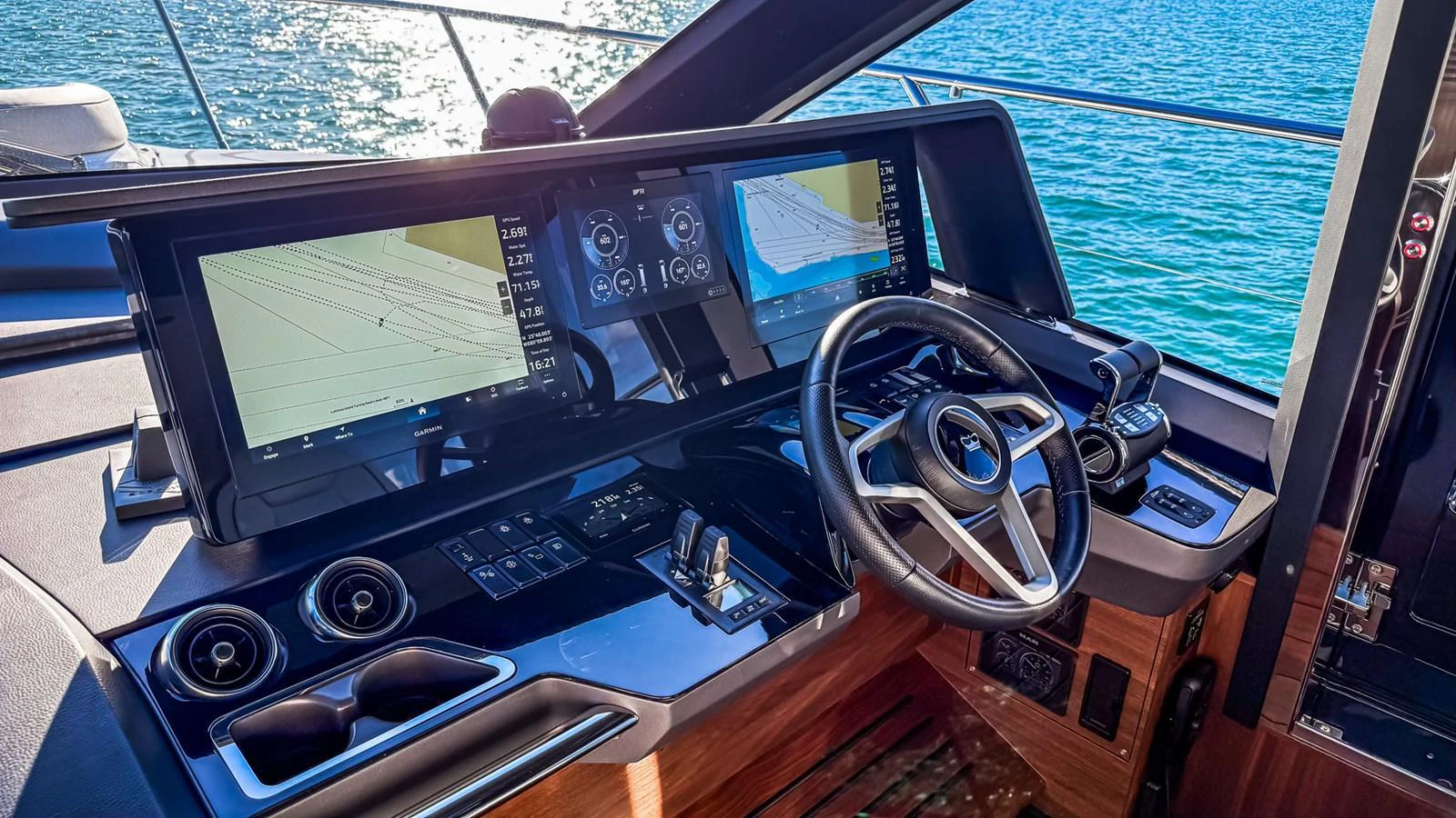 The helm station features advanced navigation systems and a sleek steering wheel, offering a commanding view of the water. aboard NAUTILUS Yacht for Sale