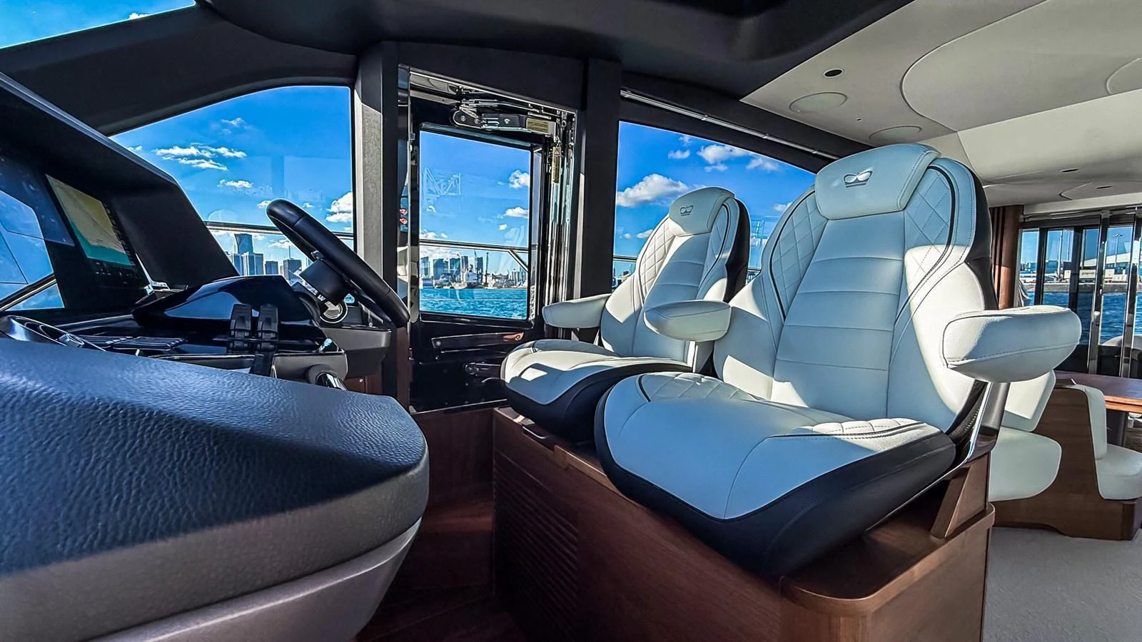 The helm area features luxurious seating with a panoramic view of the water and skyline. aboard NAUTILUS Yacht for Sale