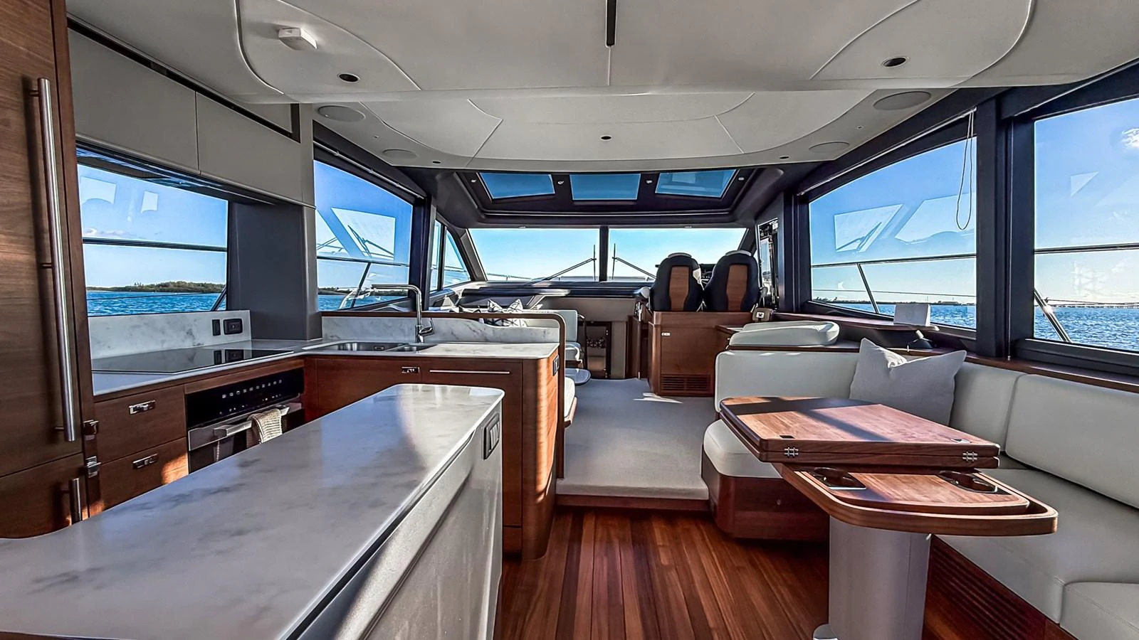 The salon offers a spacious and modern interior with panoramic views and luxurious furnishings. aboard NAUTILUS Yacht for Sale