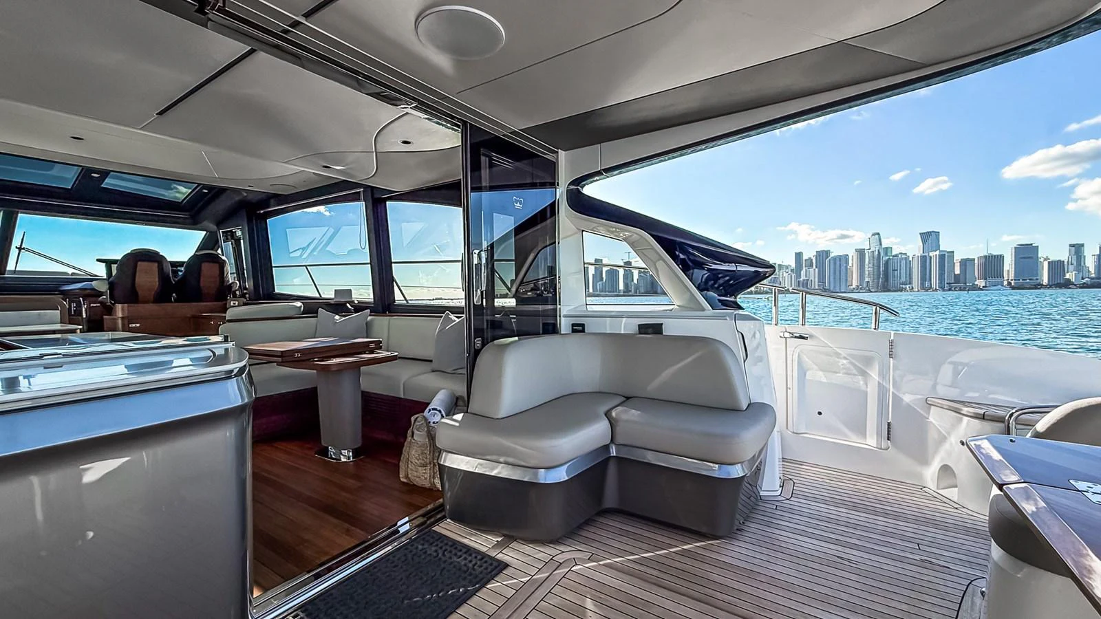 The saloon offers a spacious and modern seating area with a stunning view of the city skyline. aboard NAUTILUS Yacht for Sale