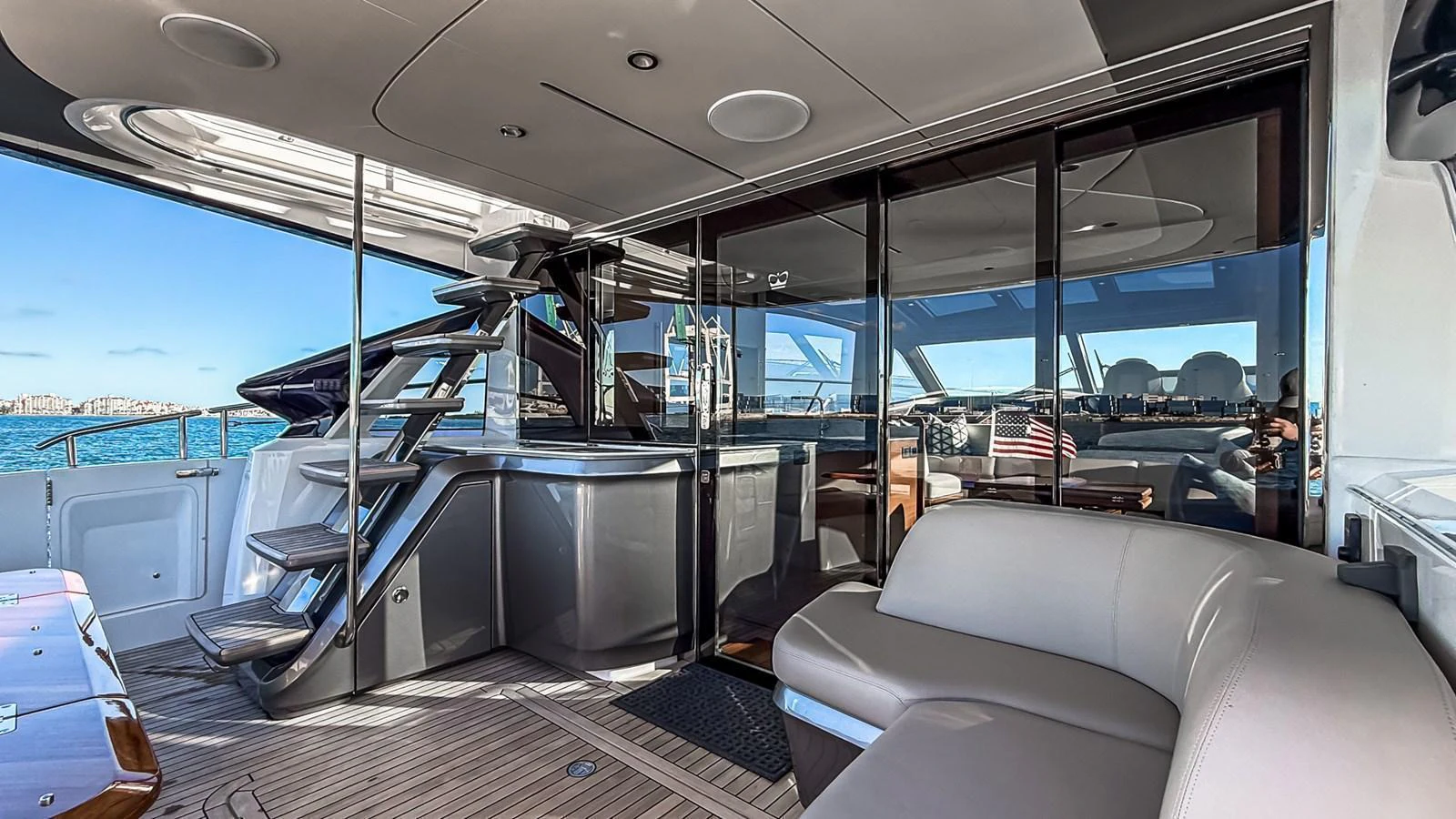 The yacht's salon features a sleek and modern design with comfortable seating and expansive windows offering stunning ocean views. aboard NAUTILUS Yacht for Sale