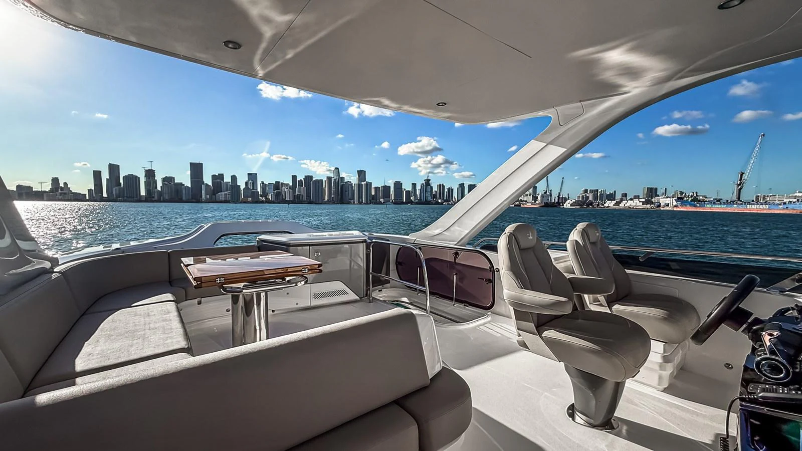 The helm area offers a panoramic view of the city skyline, blending luxury with functionality. aboard NAUTILUS Yacht for Sale
