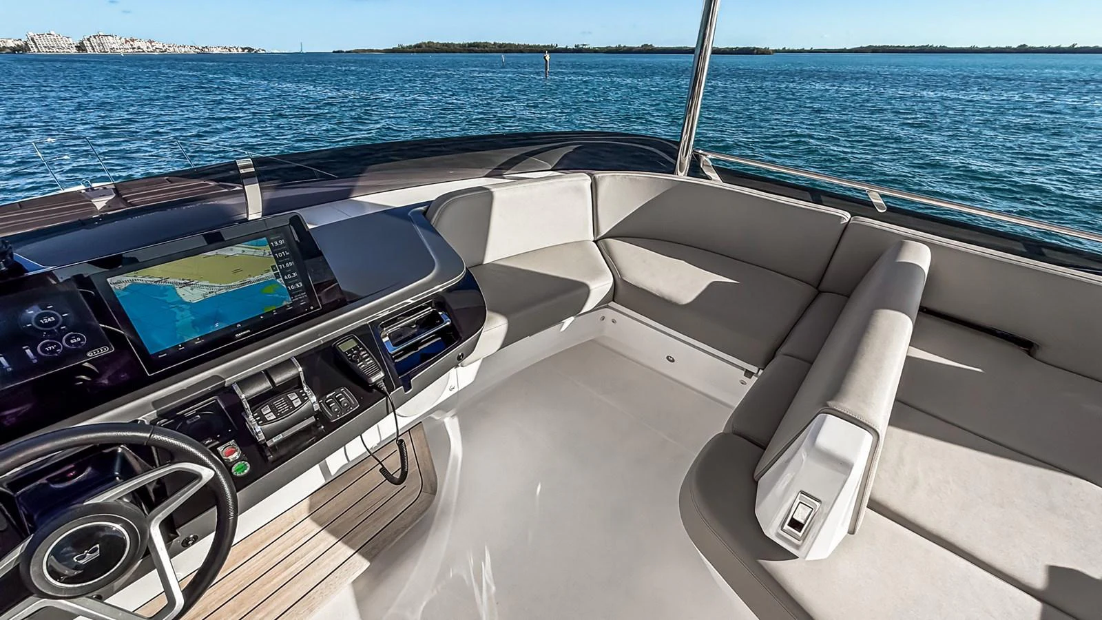 The helm area features modern navigation equipment and comfortable seating with a stunning view of the water. aboard NAUTILUS Yacht for Sale