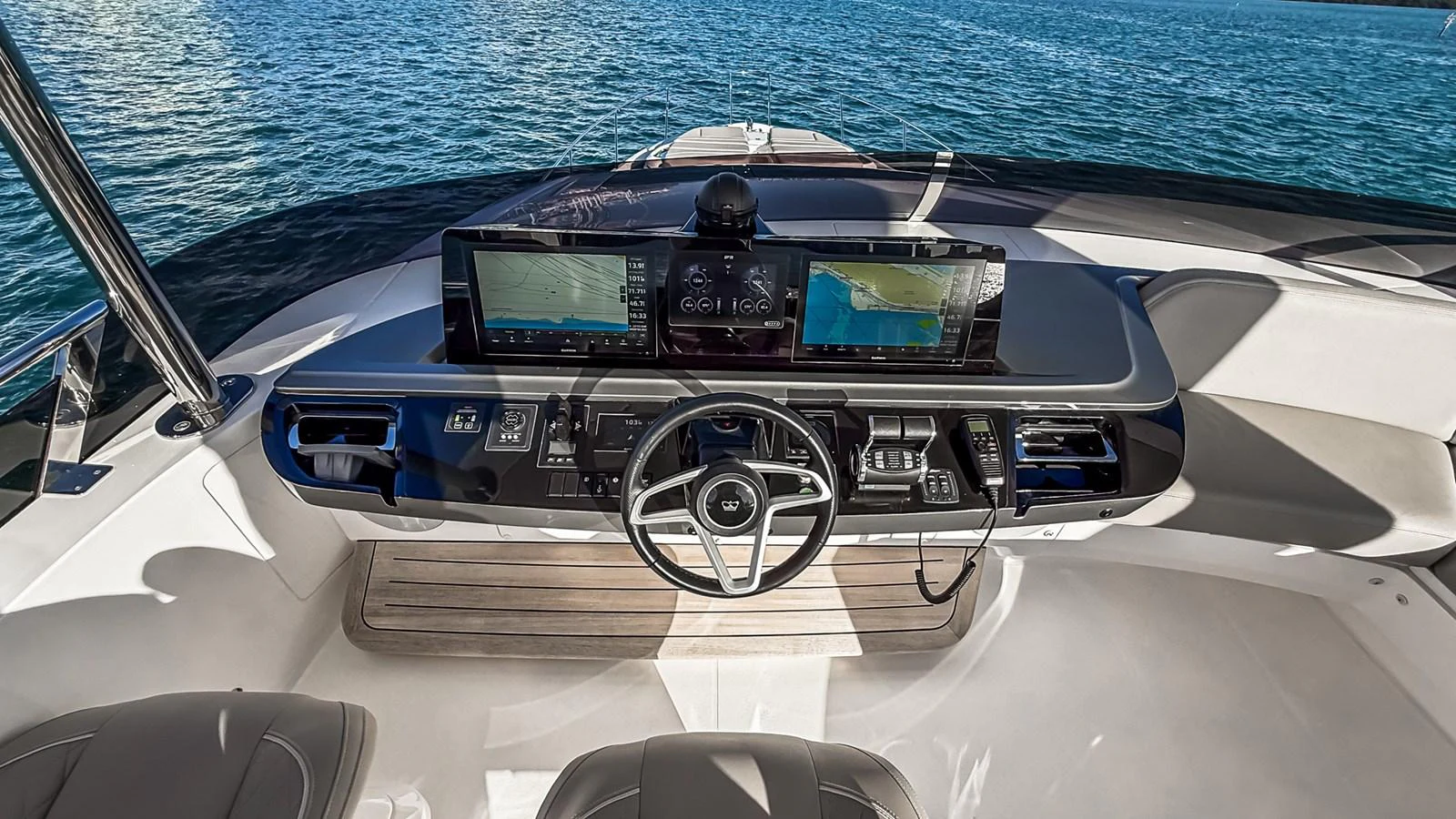 The helm station features modern navigation equipment and a sleek design, offering a commanding view of the water. aboard NAUTILUS Yacht for Sale