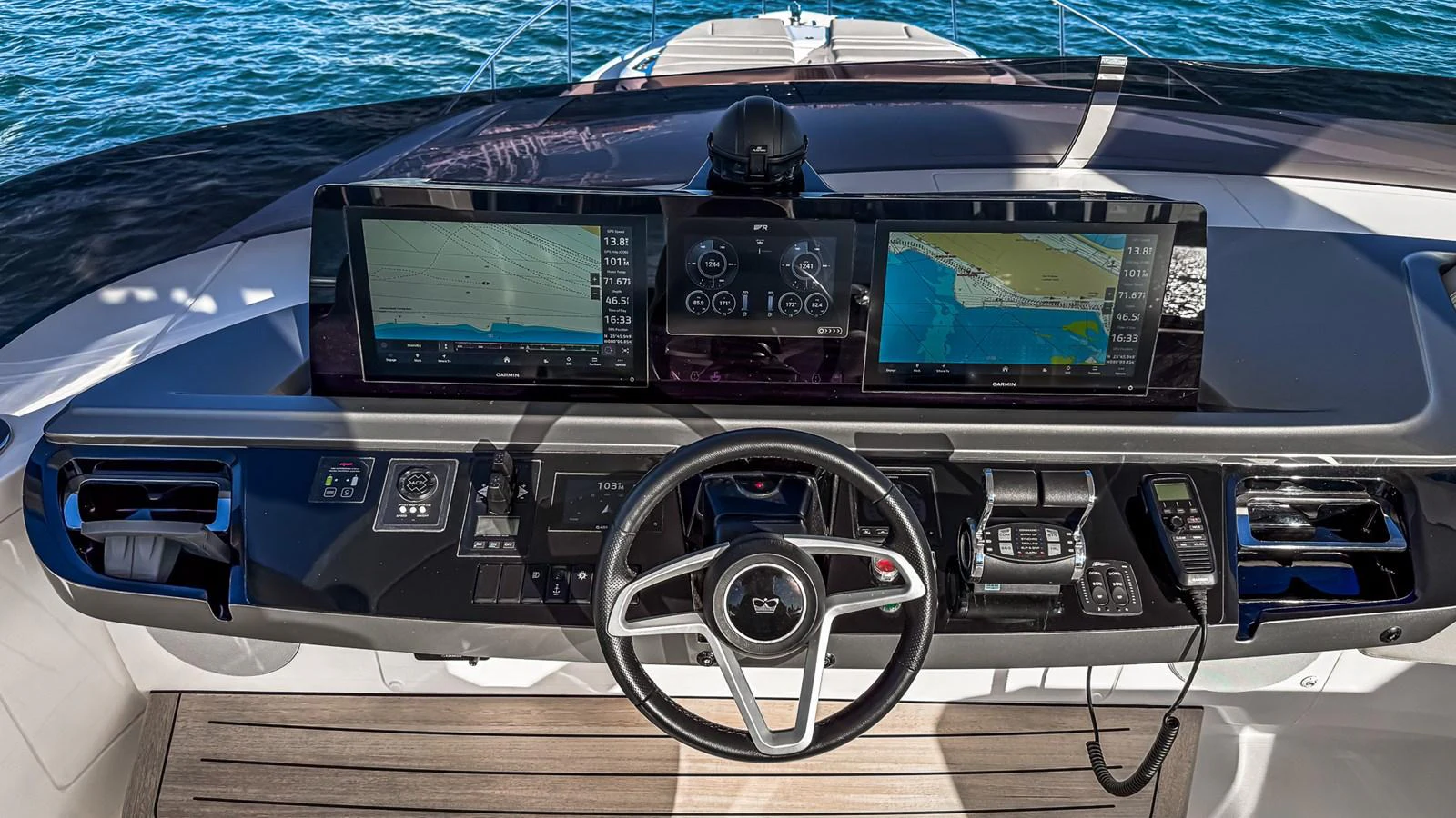 The helm station features advanced navigation equipment and a sleek steering wheel, offering a commanding view of the water. aboard NAUTILUS Yacht for Sale