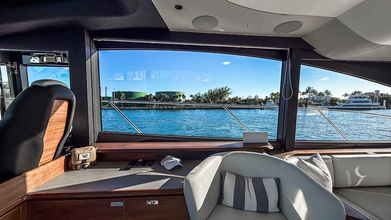 The salon offers a panoramic view of the water through large windows, complemented by comfortable seating and modern finishes. aboard NAUTILUS Yacht for Sale
