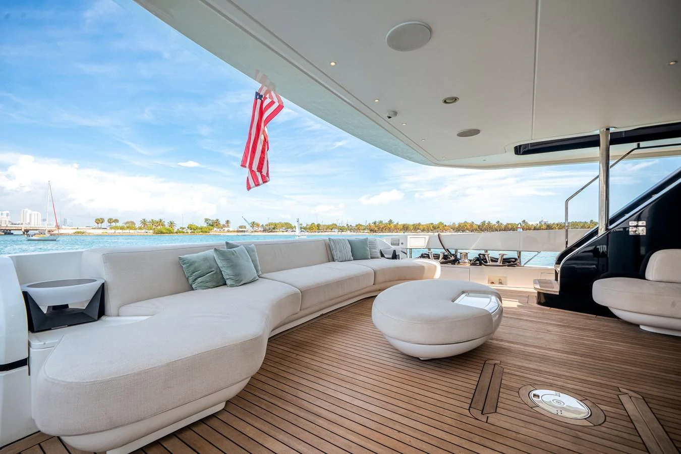 The aft deck features a spacious seating area with a modern design and stunning views. aboard TYCOON Yacht for Sale