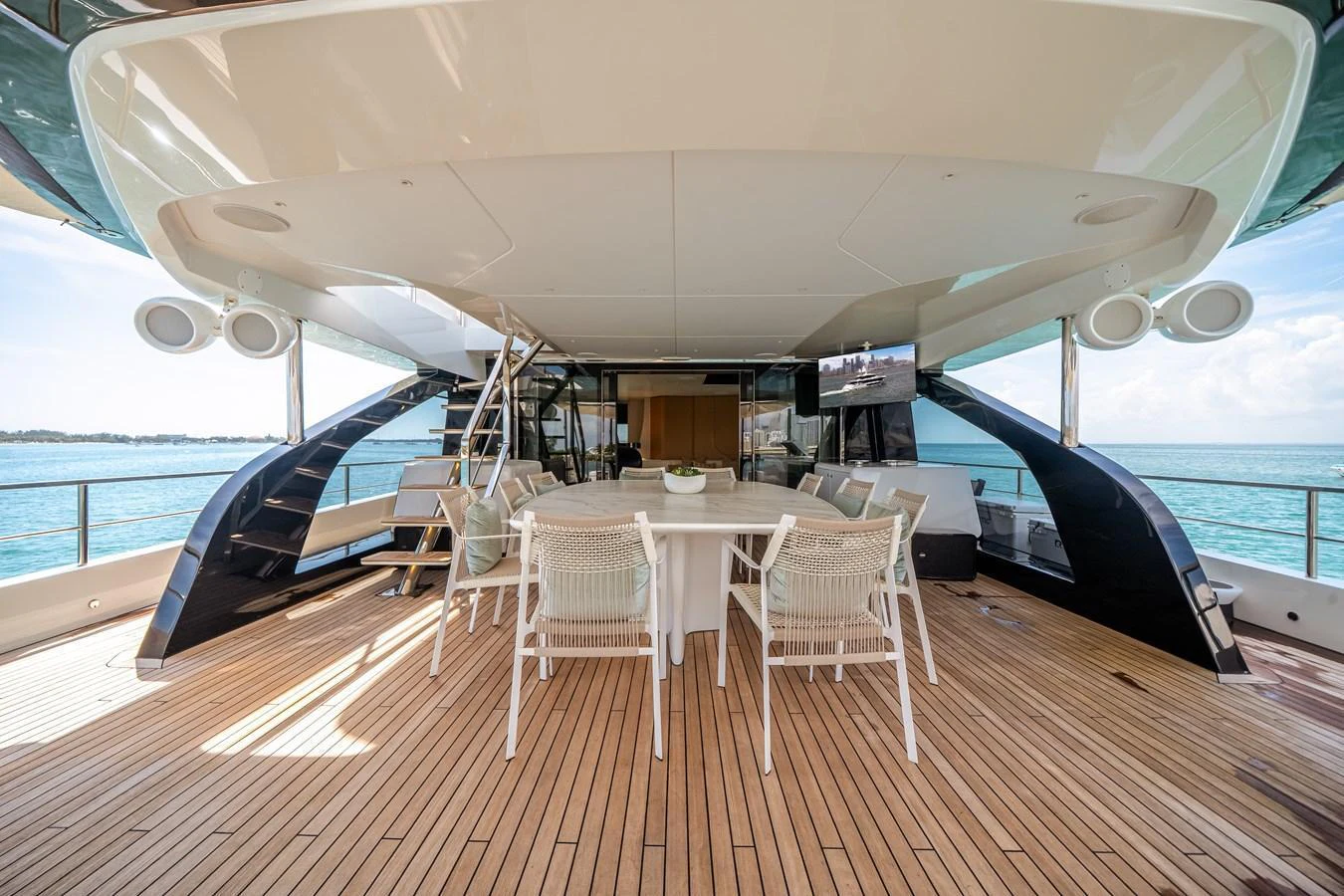 The aft deck features a spacious dining area with a beautiful view of the sea. aboard TYCOON Yacht for Sale