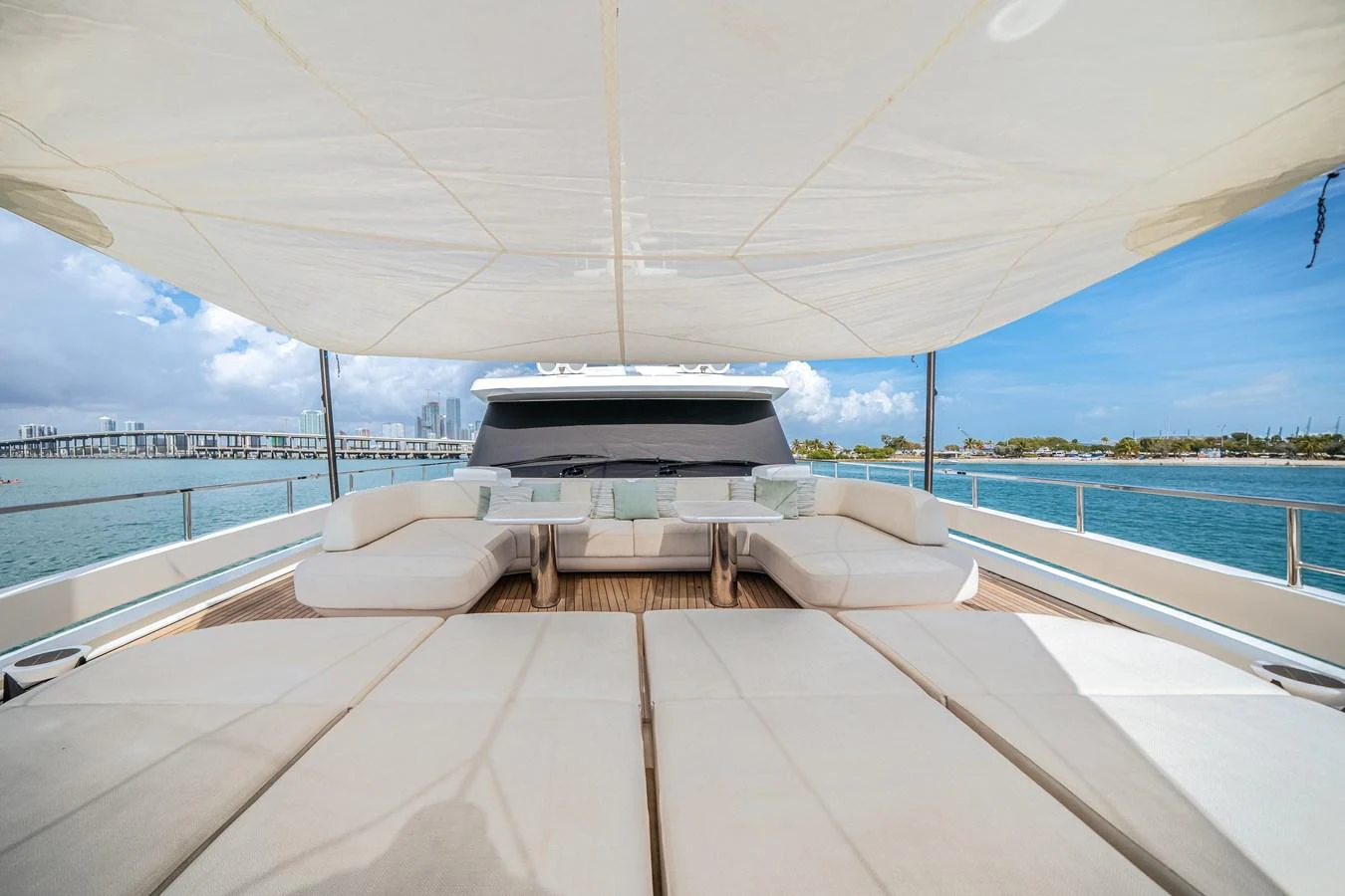The sundeck offers spacious lounging areas with a canopy providing shade and comfort. aboard TYCOON Yacht for Sale