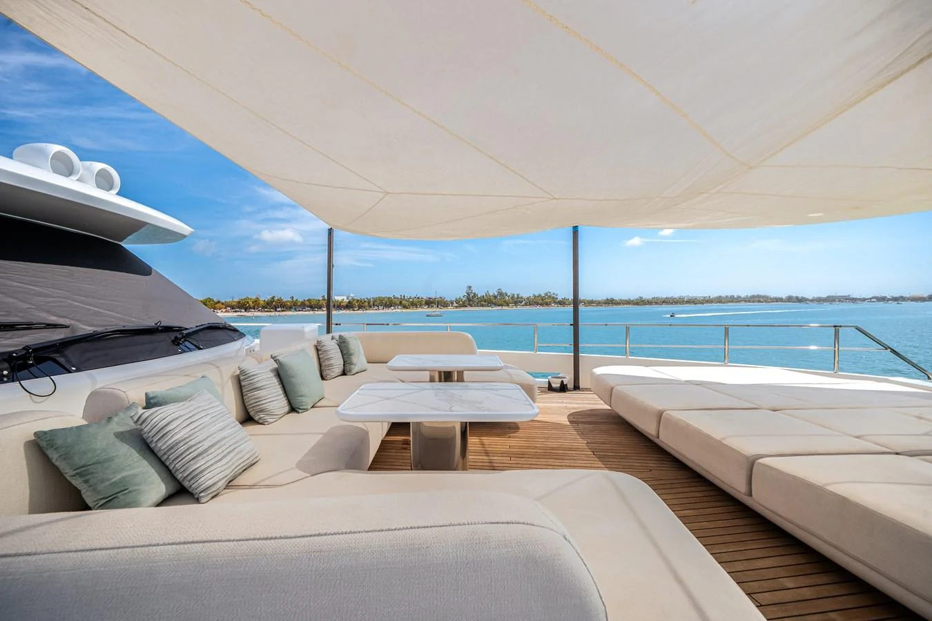 The sundeck offers a luxurious lounging area with comfortable seating and stunning ocean views. aboard TYCOON Yacht for Sale