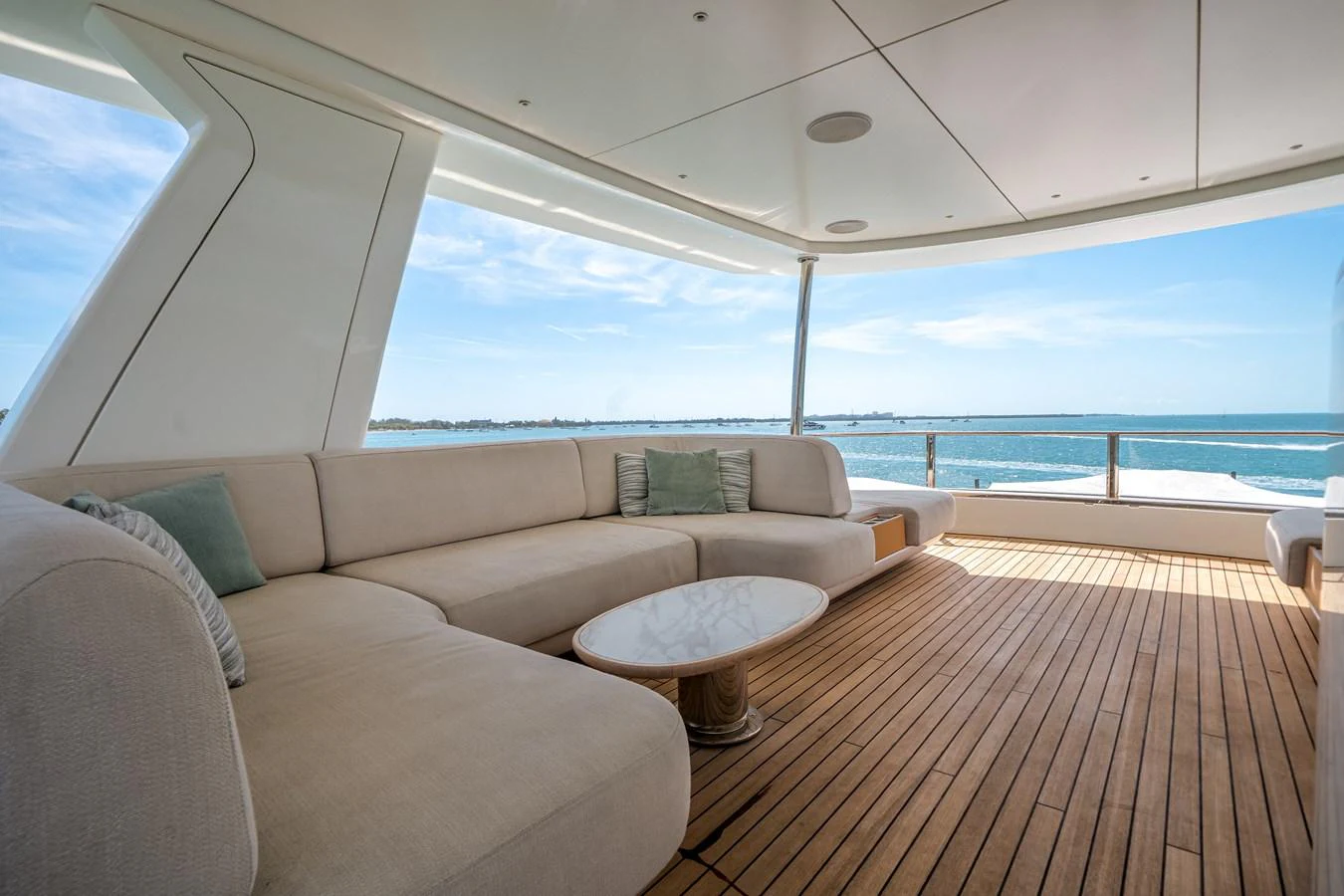 The aft deck features a spacious and comfortable seating area with stunning ocean views. aboard TYCOON Yacht for Sale