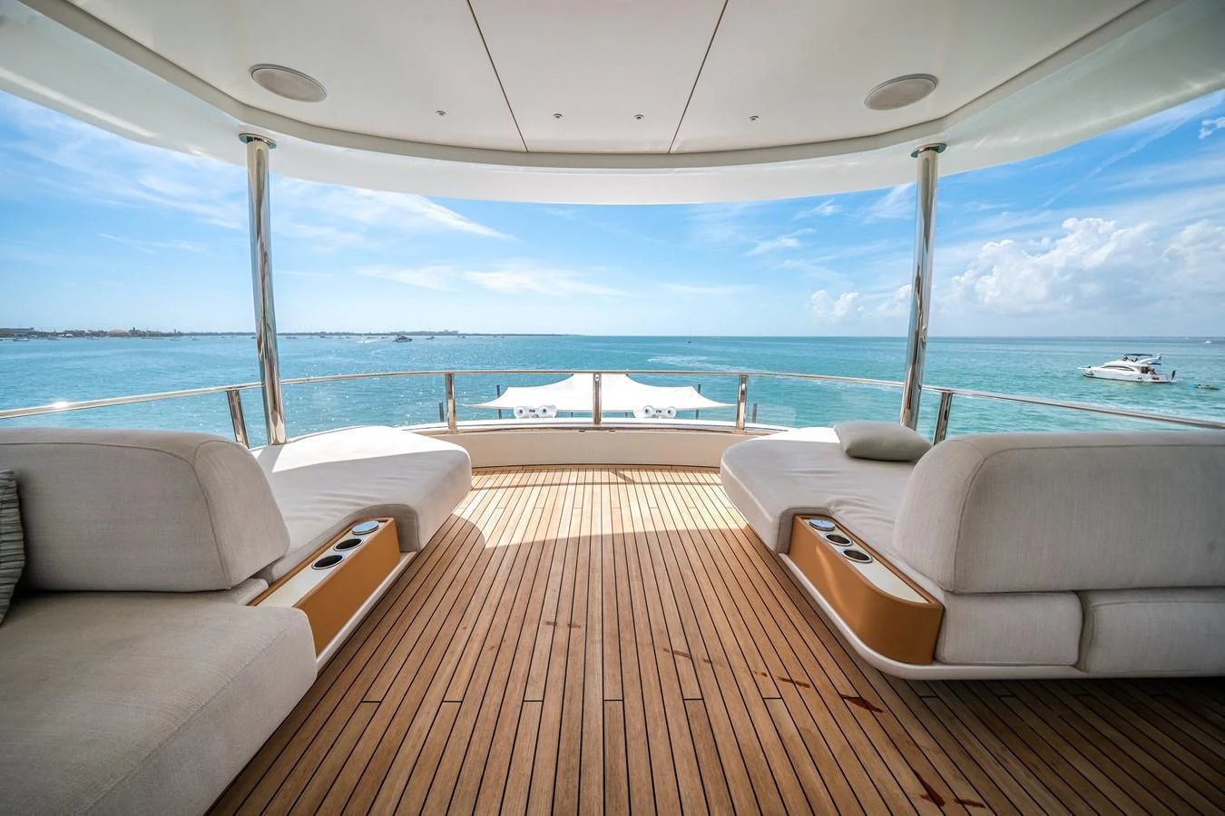 The aft deck offers a serene lounging area with panoramic ocean views. aboard TYCOON Yacht for Sale