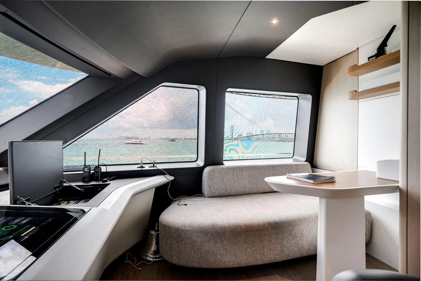 The helm area features modern design with expansive windows offering panoramic views. aboard TYCOON Yacht for Sale