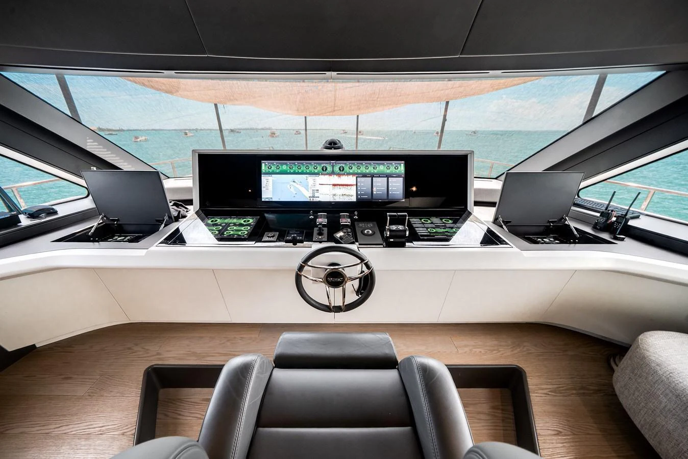 The helm station offers a state-of-the-art navigation experience with panoramic views. aboard TYCOON Yacht for Sale