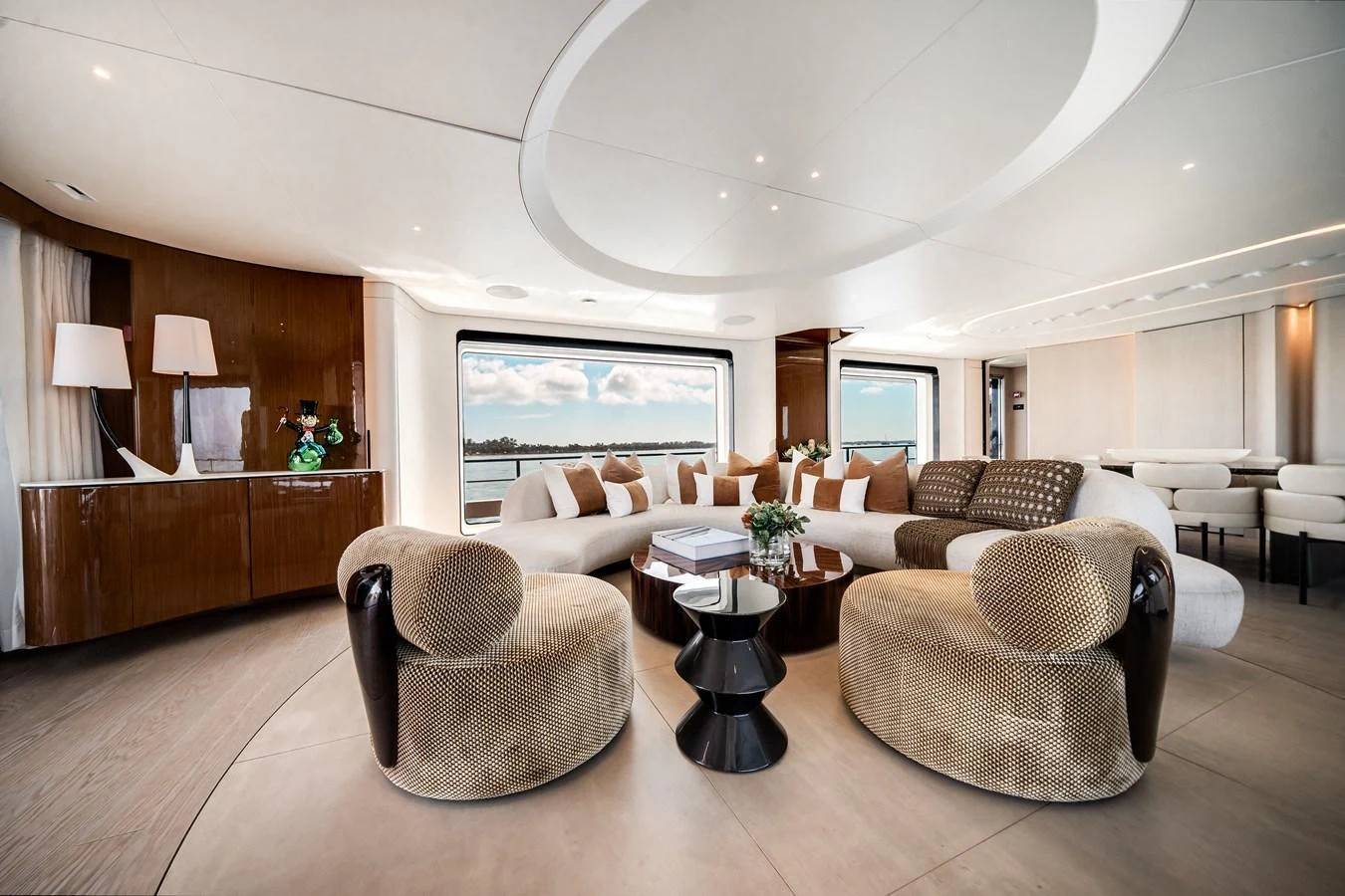 The yacht's salon features a spacious and elegant seating area with panoramic windows offering stunning views. aboard TYCOON Yacht for Sale