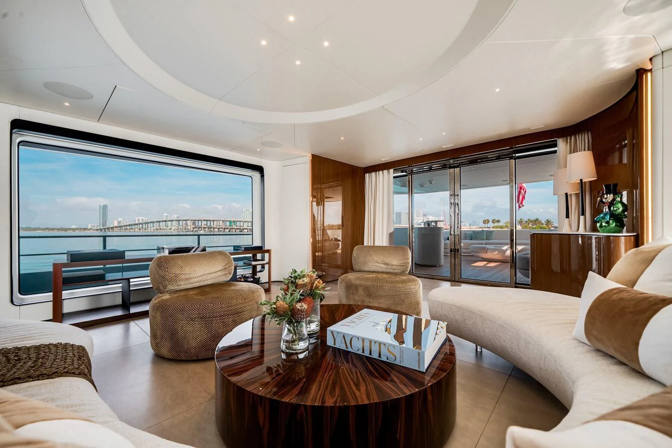The salon offers a luxurious and spacious area with panoramic views and elegant furnishings. aboard TYCOON Yacht for Sale