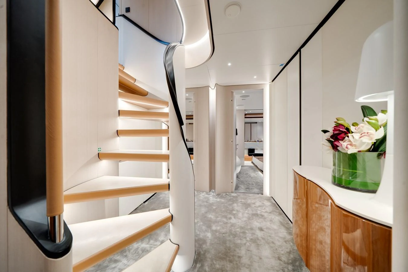 A luxurious interior staircase with elegant design and modern decor. aboard TYCOON Yacht for Sale