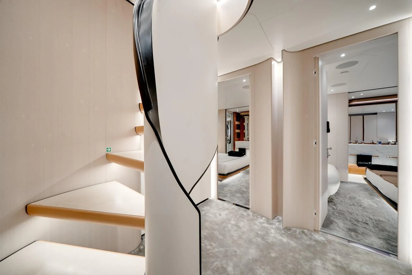 The yacht's interior features a modern staircase and a spacious, well-lit hallway with luxurious finishes. aboard TYCOON Yacht for Sale